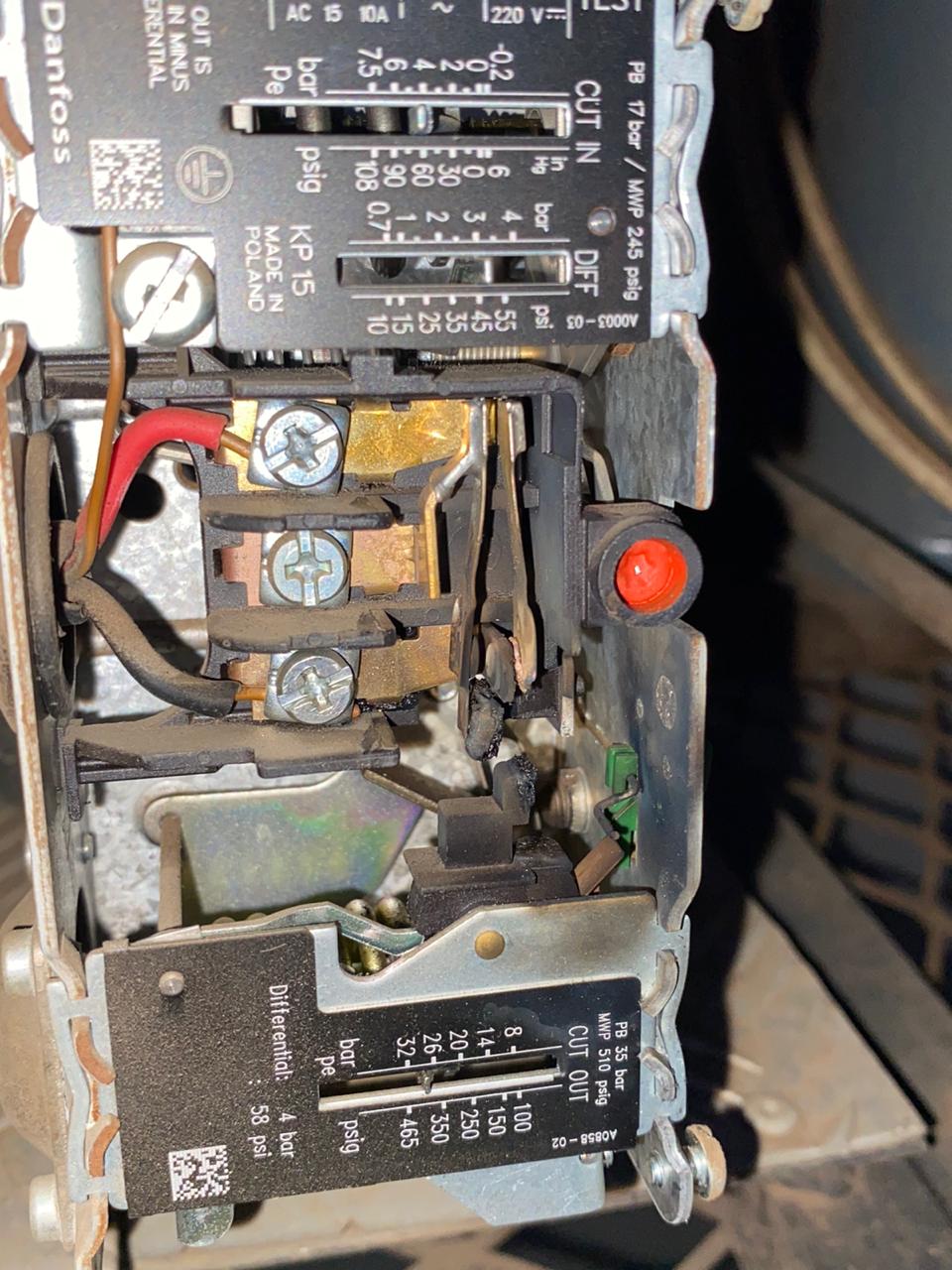 Burnt contacts inside pressure switch, which could lead to future system failure